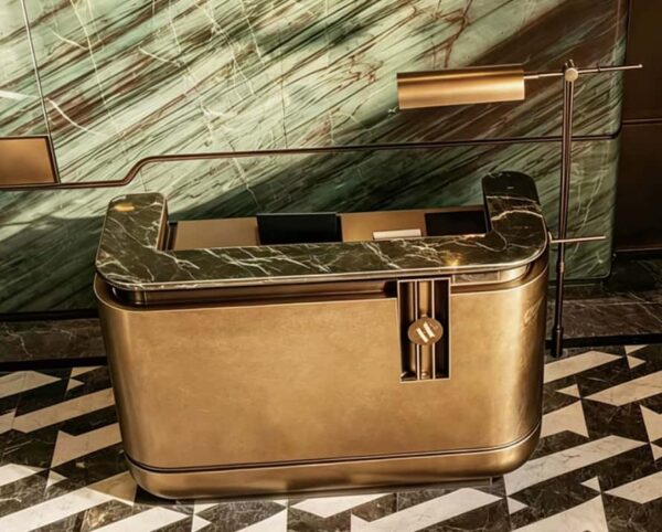 reception desk (2) Antique brass rounded luxury reception desk with marble top, metal hotel lobby front counter Lexio Display for high‑end commercial interior fit‑out