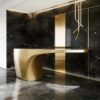 Fluid cantilever curved gold sculptural reception desk, floating‑top lobby front counter Lexio Display for premium hotel and corporate interior