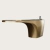 Fluid cantilever curved gold sculptural reception desk, floating‑top lobby front counter Lexio Display for premium hotel and corporate interior