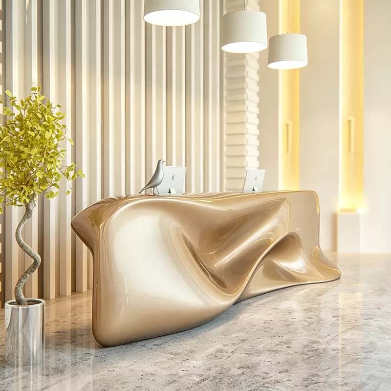 Glossy champagne gold organic fluid wave sculptural reception desk, multi‑workstation lobby counter Lexio Display for modern luxury lobby interior