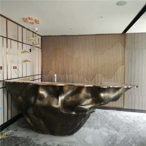 Sculptural fluid crumpled‑form abstract art reception desk, metallic lobby front counter Lexio Display for gallery and high‑end commercial interior