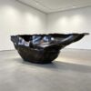 Sculptural fluid crumpled‑form abstract art reception desk, metallic lobby front counter Lexio Display for gallery and high‑end commercial interior