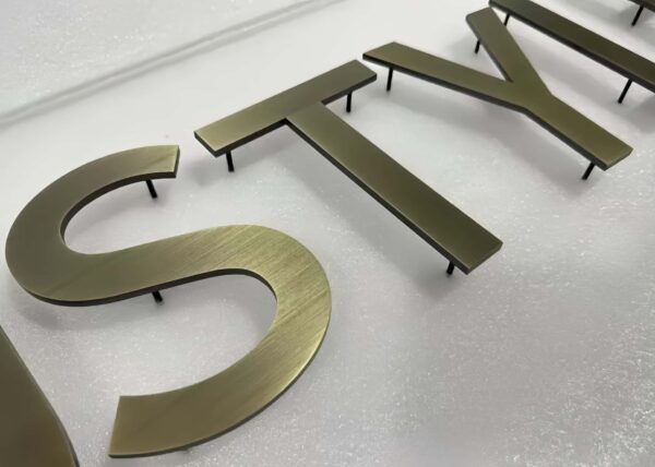Mixed finish 3D stainless steel numbers, gold, silver and bronze solid metal digits