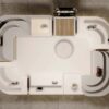 Top-down floor plan layout of curved mall handbag kiosk, overhead view of retail display booth