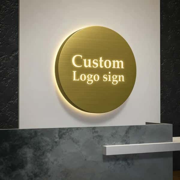 Custom circular LED backlit business wall sign, mirror gold stainless steel panel with glowing cutout logo