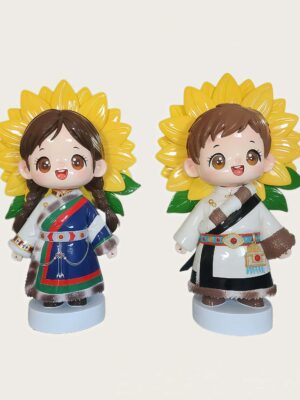 Studio photo of twin ethnic kids fiberglass mascot sculptures, girl and boy in traditional ethnic costume with large sunflower backdrop, standing on light blue round bases