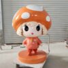 Front view of glossy fiberglass mushroom girl IP statue, orange mushroom cap with white dots, hoodie and backpack, ready for commercial display