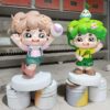 Customized fiberglass display (5) Pair custom cartoon kid mascot fiberglass sculpture, nature themed twin characters for shopping mall exhibition and environmental promotion decor