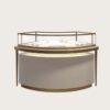 Round curved jewellery display island brushed gold frame cream matte base Lexio Display`