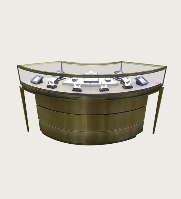 Antique brass curved jewellery island display counter slim angled metal legs Lexio Display`