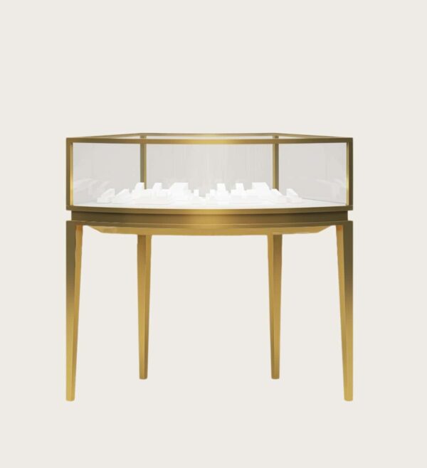 Octagon elevated open‑frame jewelry display table brushed gold metal octagonal glass showcase Lexio Display`