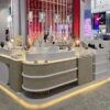 Modern Wavy Shape Jewelry Retail Kiosk, Gold Stainless Steel Frame Jewellery Display Counter