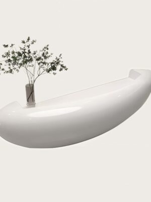 1. 3/4 perspective curved oval white fiberglass front desk, integrated drawers and flat working surface for lobby reception