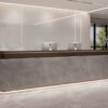 Plain background product shot custom stone reception desk for commercial office fit-out project