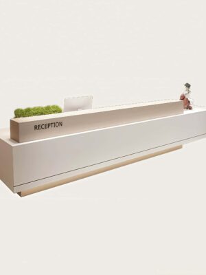Isolated product shot of custom white reception counter with wood grain partition and plant shelf for commercial fitout project