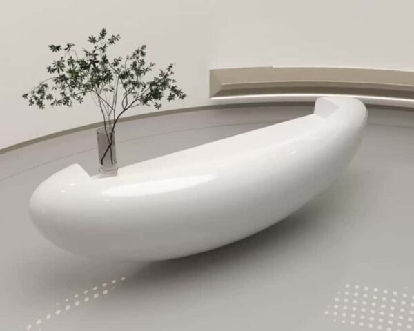 reception desk (3) Side view modern oval fiberglass reception counter, high gloss white surface displayed in minimalist plain showroom